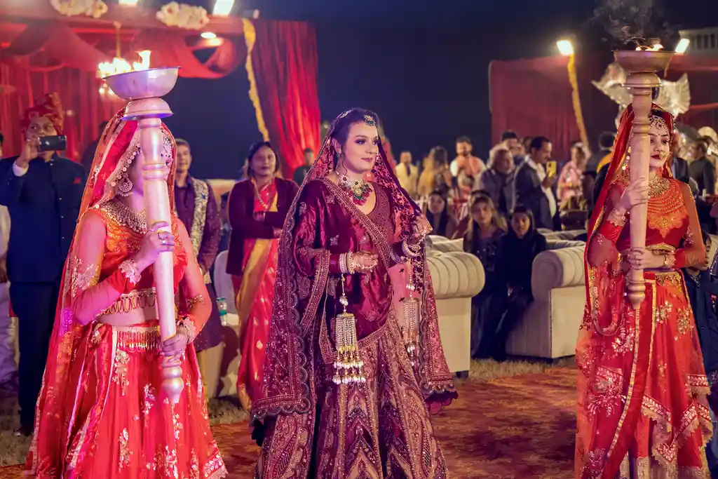 Bride entry with traditional mashals at a Taj Ganges Varanasi wedding by The WeddingShoot